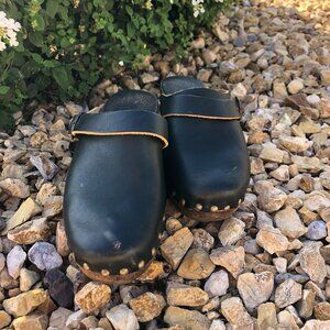 Black leather clogs